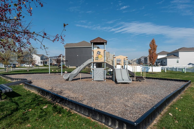 view of playground with a lawn