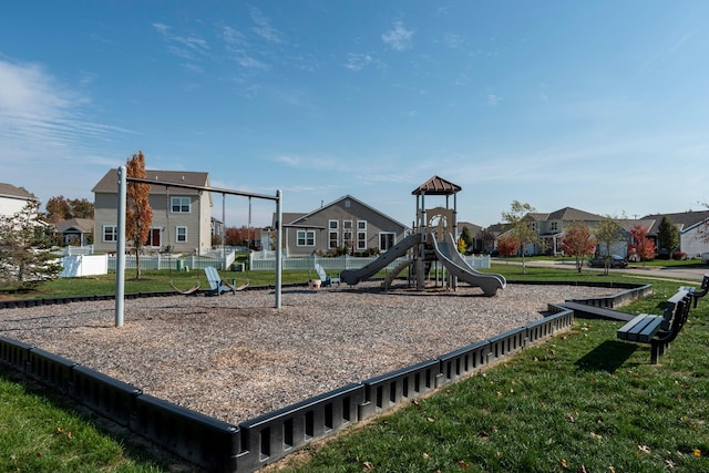 view of playground with a lawn