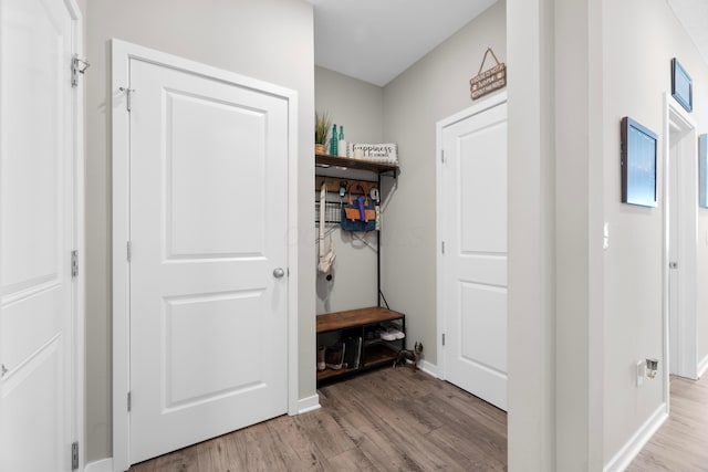 mudroom with light hardwood / wood-style floors