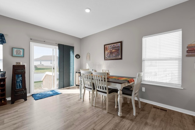 dining room with light hardwood / wood-style flooring