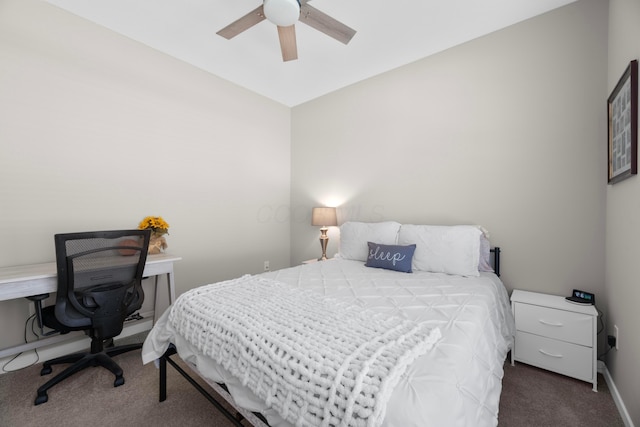 bedroom with dark carpet and ceiling fan