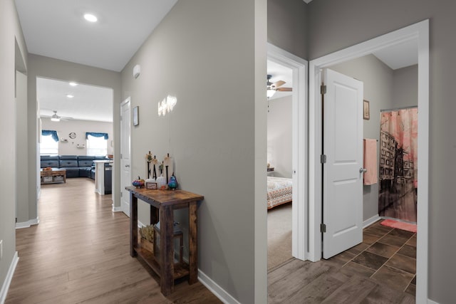 corridor with dark hardwood / wood-style floors