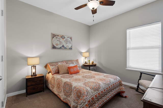 bedroom with dark colored carpet and ceiling fan