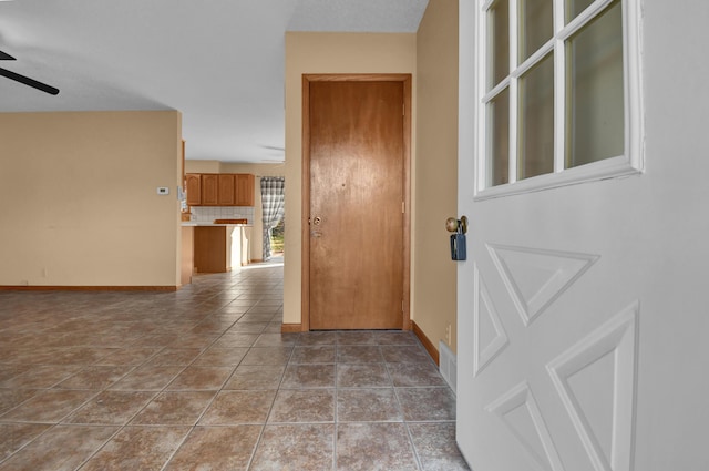 hallway featuring light tile patterned floors