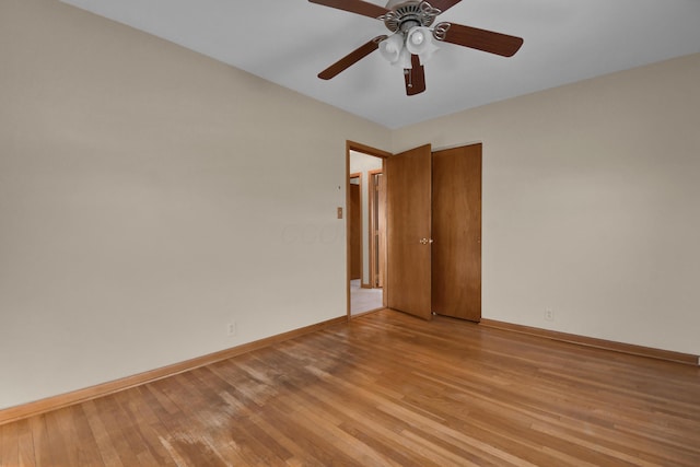 empty room featuring ceiling fan and light wood-type flooring