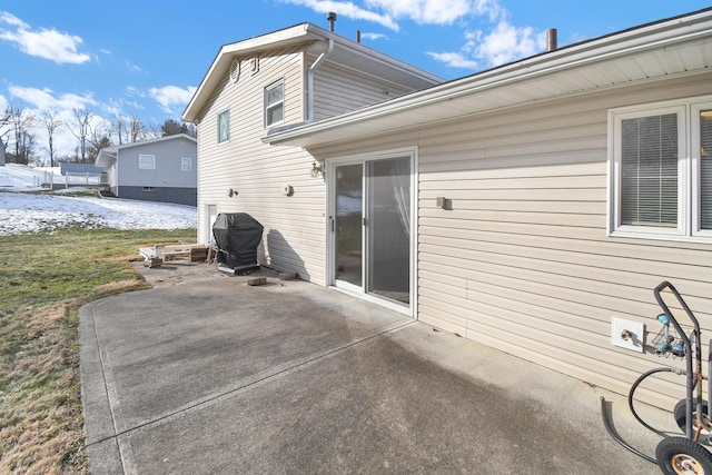 back of property with a patio