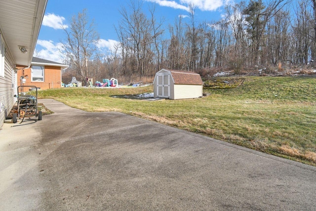 view of yard with a patio and a shed