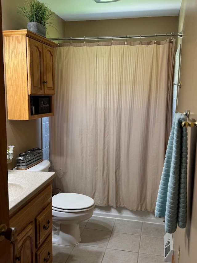 full bathroom with shower / bathtub combination with curtain, toilet, vanity, and tile patterned flooring