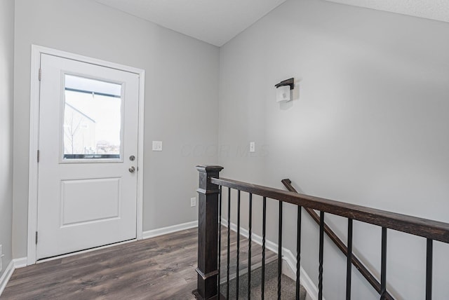 foyer with dark hardwood / wood-style floors