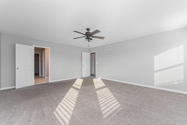 unfurnished room featuring light carpet and ceiling fan