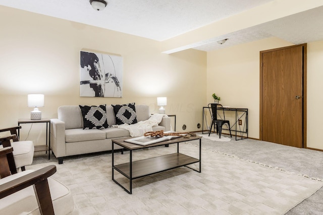 living room featuring light carpet and a textured ceiling