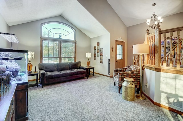 carpeted living room featuring a textured ceiling, high vaulted ceiling, and a chandelier