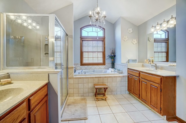 bathroom featuring tile patterned flooring, vanity, vaulted ceiling, independent shower and bath, and a chandelier