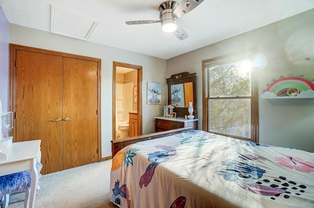 bedroom with light carpet, connected bathroom, a closet, and ceiling fan