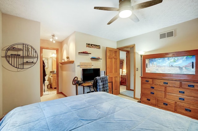 bedroom featuring connected bathroom, a textured ceiling, and ceiling fan