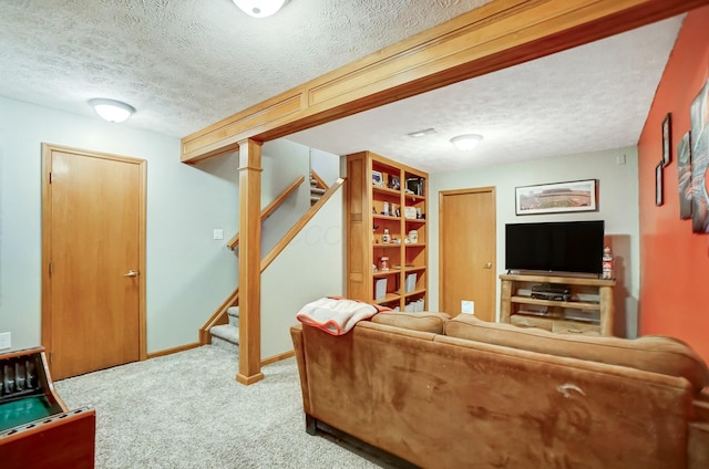 living room with carpet floors and a textured ceiling