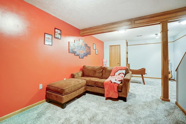 living room featuring beamed ceiling, carpet, and a textured ceiling