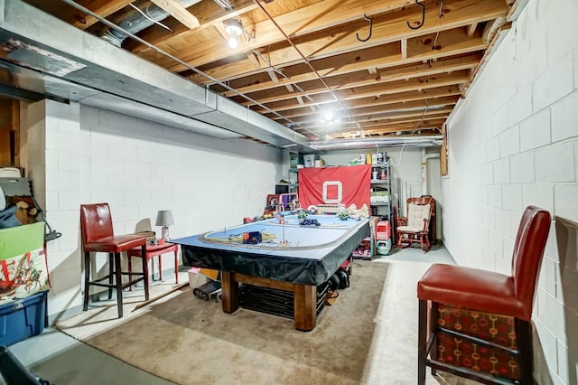 game room with pool table and concrete flooring