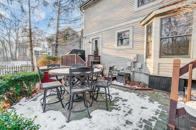 view of snow covered patio