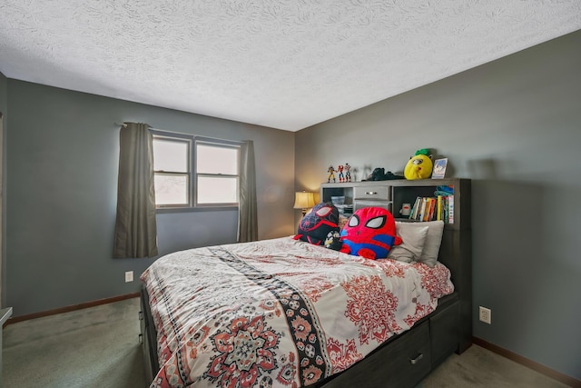 bedroom featuring light carpet and a textured ceiling