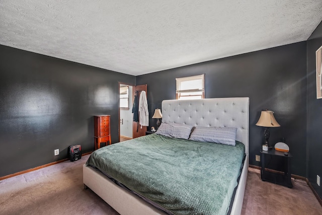 carpeted bedroom featuring a textured ceiling