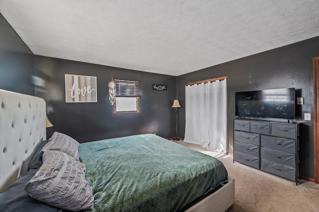 carpeted bedroom with a textured ceiling