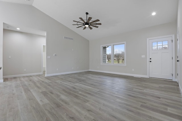 unfurnished living room with high vaulted ceiling, ceiling fan, and light hardwood / wood-style flooring