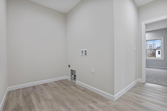 clothes washing area with washer hookup, hookup for an electric dryer, and light hardwood / wood-style floors