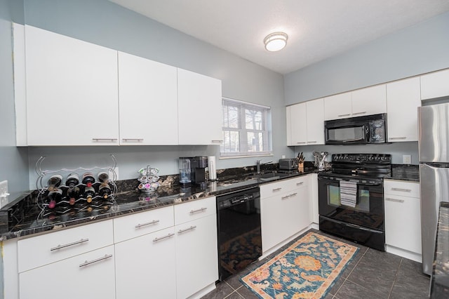 kitchen featuring white cabinetry, sink, black appliances, and dark stone counters