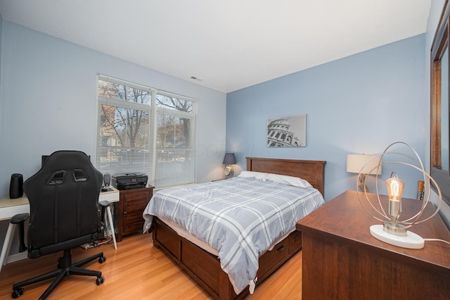 bedroom with light hardwood / wood-style floors