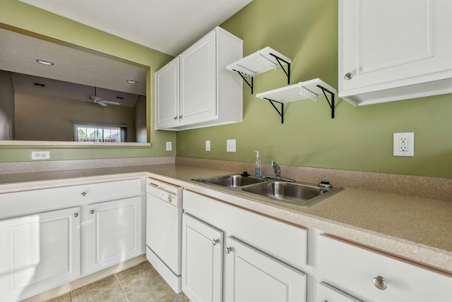 kitchen with white cabinetry, sink, light tile patterned floors, ceiling fan, and white dishwasher