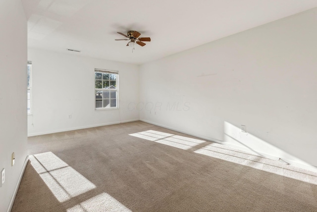 carpeted empty room with ceiling fan