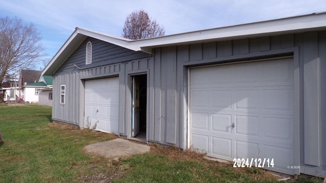 garage with a yard