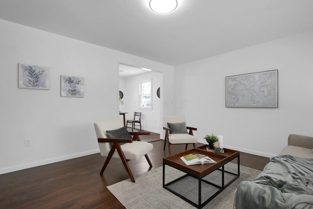 living room featuring dark wood-type flooring