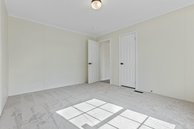 spare room with light carpet