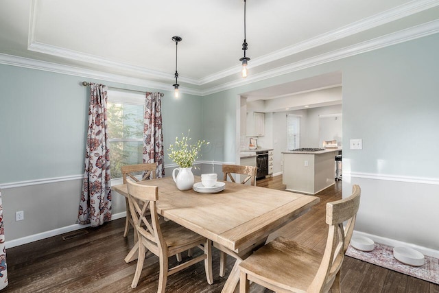 dining space featuring ornamental molding and dark hardwood / wood-style floors