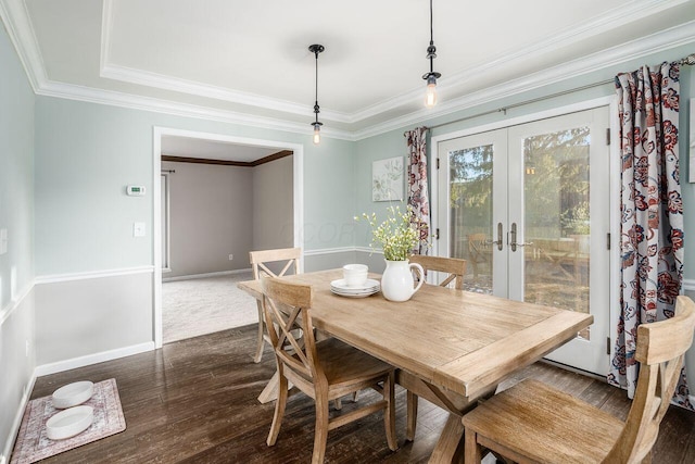 dining area featuring french doors, ornamental molding, and dark hardwood / wood-style floors