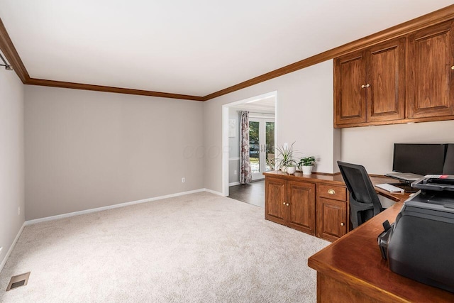 office area with crown molding and light carpet