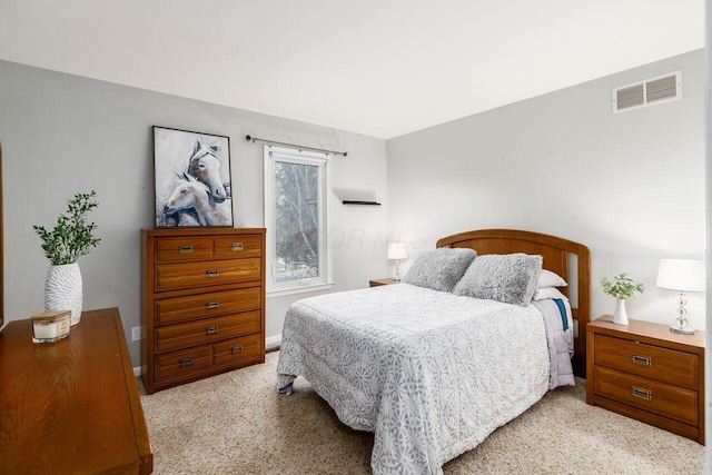 bedroom featuring light carpet