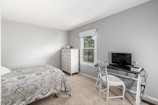 bedroom with light carpet