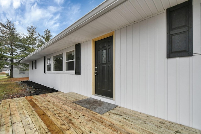 property entrance with a deck