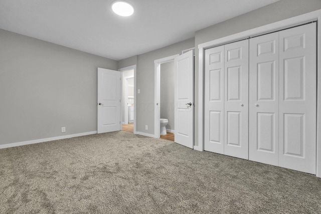 unfurnished bedroom with carpet flooring and a closet