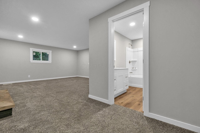 basement with light colored carpet