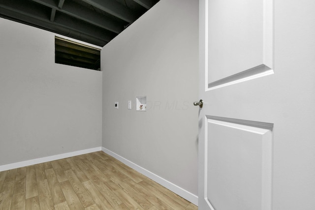 basement with light hardwood / wood-style flooring