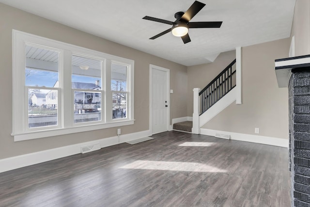 foyer entrance with dark wood-type flooring and ceiling fan