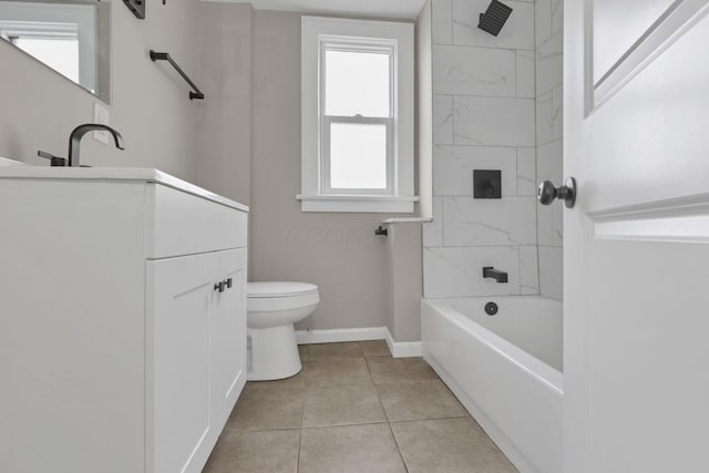 full bathroom featuring tiled shower / bath, vanity, toilet, and tile patterned flooring