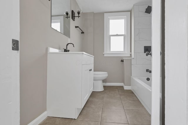 full bathroom featuring tiled shower / bath combo, vanity, tile patterned floors, and toilet