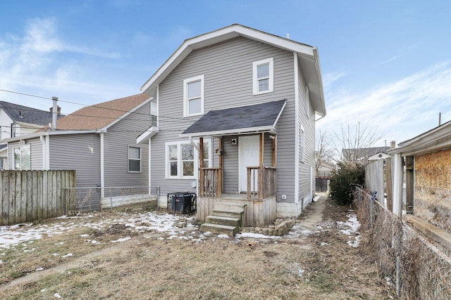 back of house featuring central AC