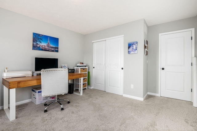 office area featuring light colored carpet