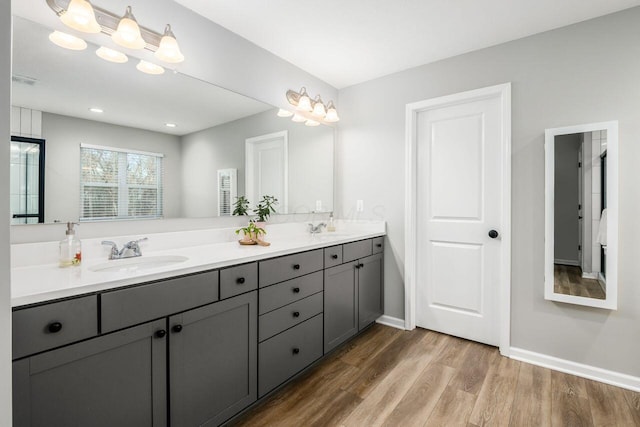 bathroom featuring hardwood / wood-style flooring and vanity